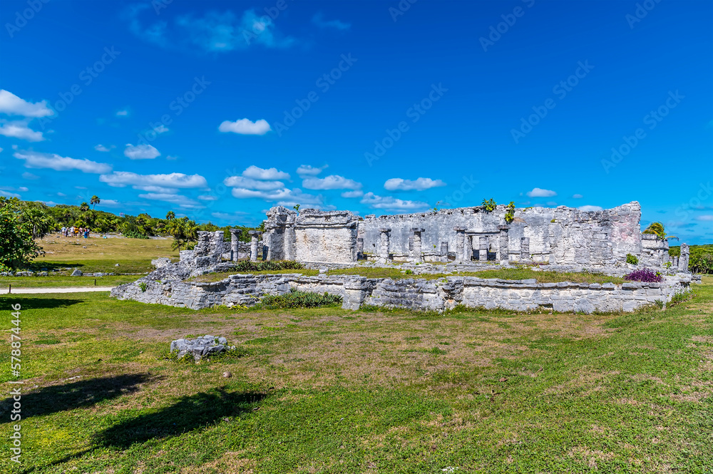 A view towards palace ruins at the Mayan settlement of Tulum, Mexico on a sunny day