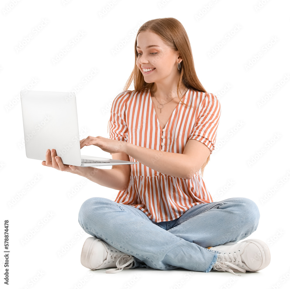 Naklejka premium Beautiful girl using laptop on white background