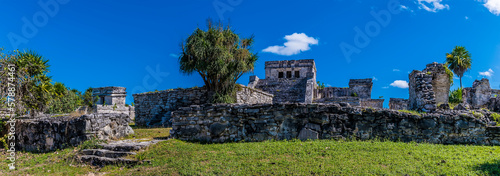A panorama view towards the oratory and central ruins at the Mayan settlement of Tulum  Mexico on a sunny day
