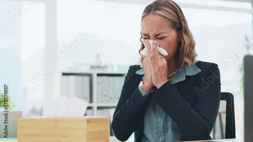 Office, tissue and woman blowing her nose while sick and working on a corporate project. Professional, hayfever and Asian female employee sneezing from the flu, cold or allergies in the workplace. photo