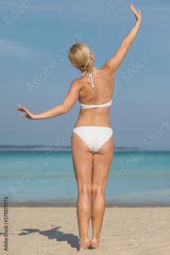 Beautiful woman in bikini on the beach © zhagunov_a