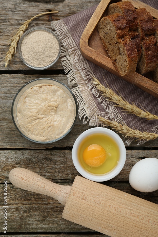 Flat lay composition with sourdough on wooden table Flat lay composition with sourdough on wooden table