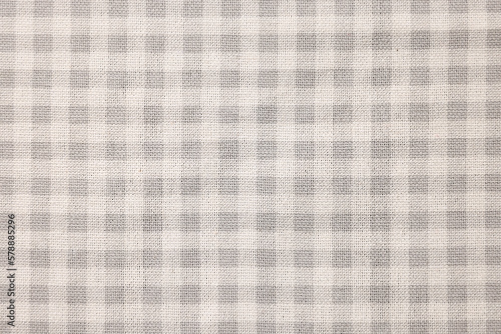 Beige checkered tablecloth as background, top view Beige checkered tablecloth as background, top view