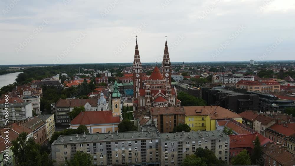 Votive Church in city of Szeged, Hungary. Aerial establishing scene, parallax. Votive Church in city of Szeged, Hungary. Aerial establishing scene, parallax.