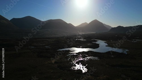 Rise up over Scottish Wilderness at dawn with Cuillin mountain silhouettes at Sligachan Isle of Skye photo