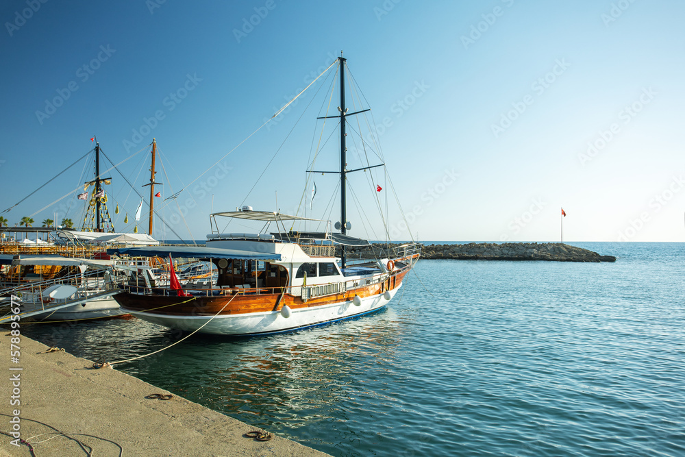 Mediterranean resort in Side in a beautiful summer day, Turkey. Yachts in harbour of resort city Side. Turkey. Mediterranean resort in Side in a beautiful summer day, Turkey. Yachts in harbour of resort city Side. Turkey.