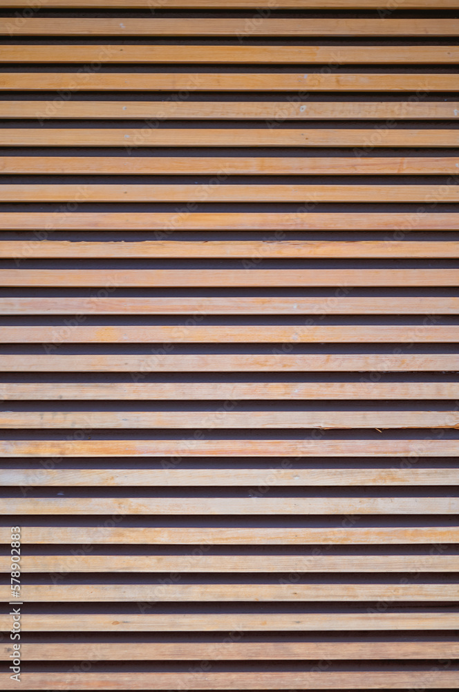Blonde Scandinavian Birchwood Planking on a Black Wall.