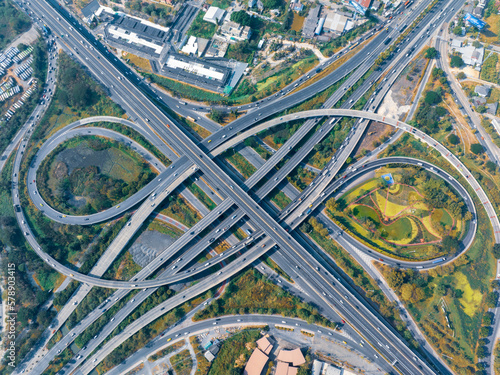 Expressway top view  Road traffic an important infrastructure  car traffic transportation above intersection road in city   aerial view cityscape of advanced innovation  financial technology  