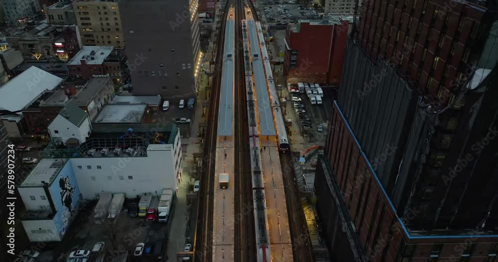 Aerial view tilting over the 125th Street railway station, gloomy evening in Harlem, NY, USA Aerial view tilting over the 125th Street railway station, gloomy evening in Harlem, NY, USA