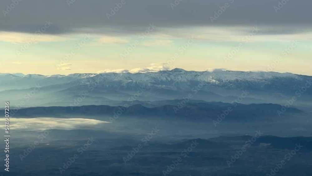 Snowy Mulahen peak landscape, in Granada, Spain, at sunrise. Cold winter day. Recorded from a jet cockpit. Pilot point of virew. Snowy Mulahen peak landscape, in Granada, Spain, at sunrise. Cold winter day. Recorded from a jet cockpit. Pilot point of virew.