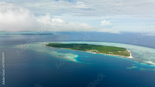 Top view of tropical island in the blue sea with a coral reef and the beach. Balabac, Palawan. Philippines.