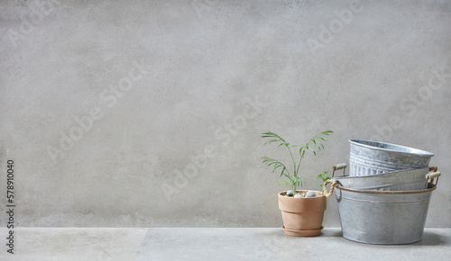 retro style, Basket, olive tree, earthen pot, stool and various objects on vintage gray concrete background © gru pictures