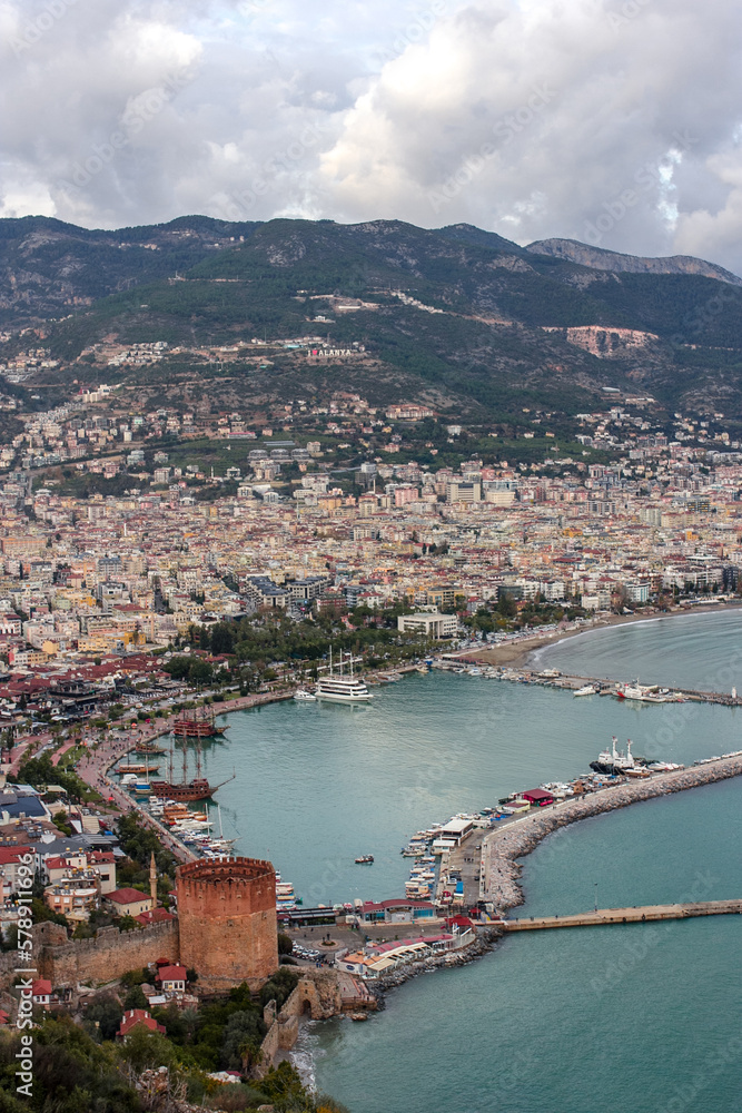  Top view of the bay area, old city, yachts, boats and mountains in Alanya, Turkey
