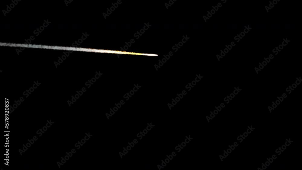 A small-sized meteor flying across the sky at a distance. The shot is 4K and comes with and without an alpha channel