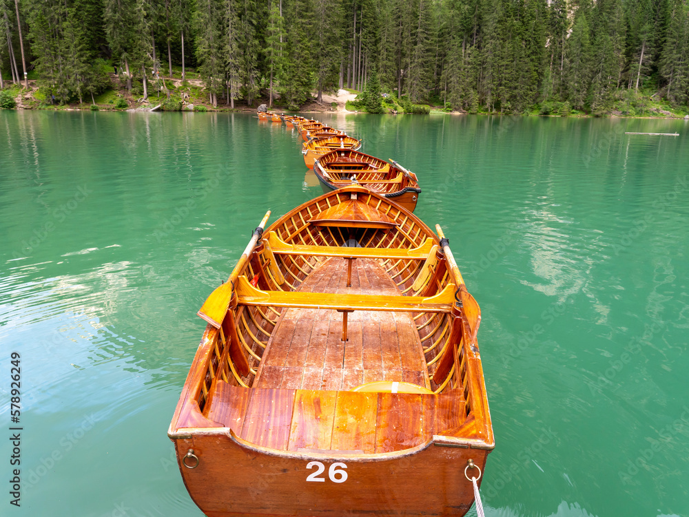 Amazing view of the famous Braies Lake in Italy. Typical rowing boats ...
