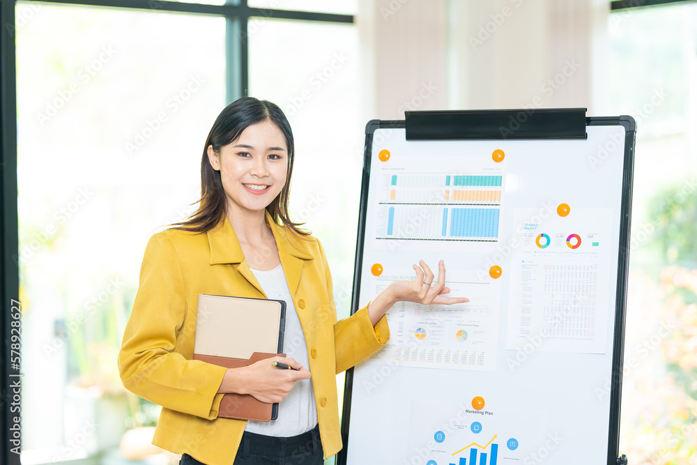 Asian business woman present business strategy plan to corporate colleagues in the meeting room. Success of business strategy plan, brainstorming, share ideas concept Asian business woman present business strategy plan to corporate colleagues in the meeting room. Success of business strategy plan, brainstorming, share ideas concept