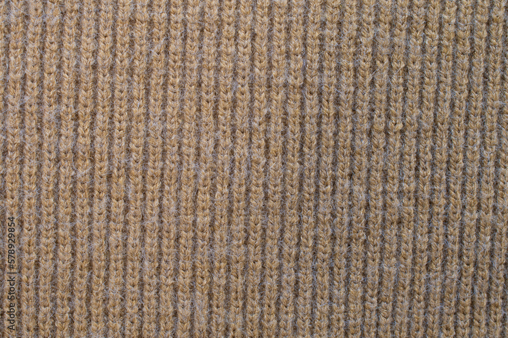 Brown wool knitted textured background close up. Handmade knitted fabric red wool background texture Brown wool knitted textured background close up. Handmade knitted fabric red wool background texture