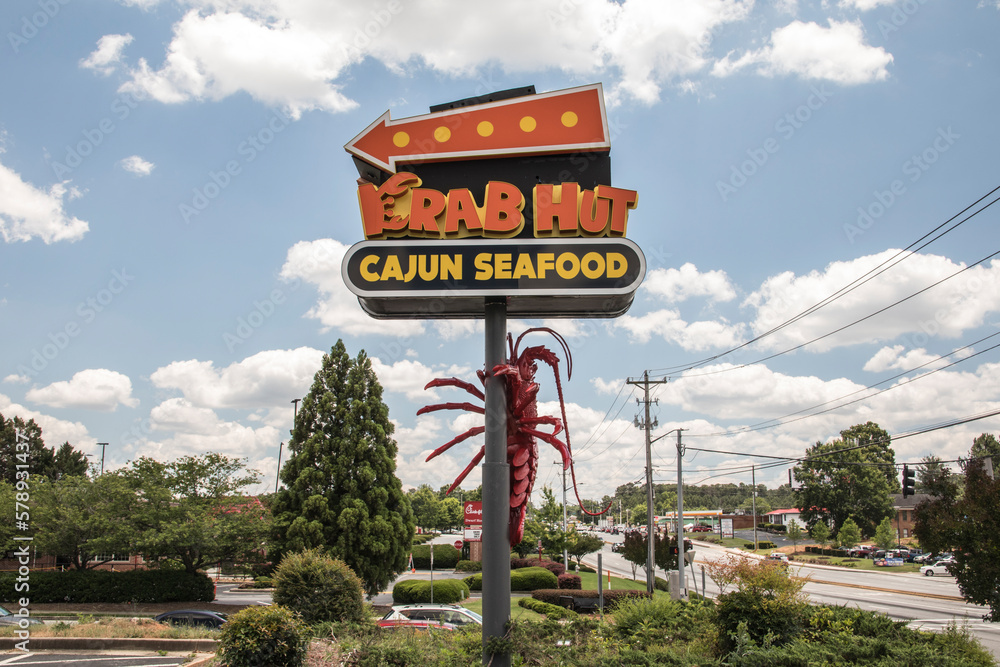 The Krab Hut seafood restaurant exterior street sign and traffic