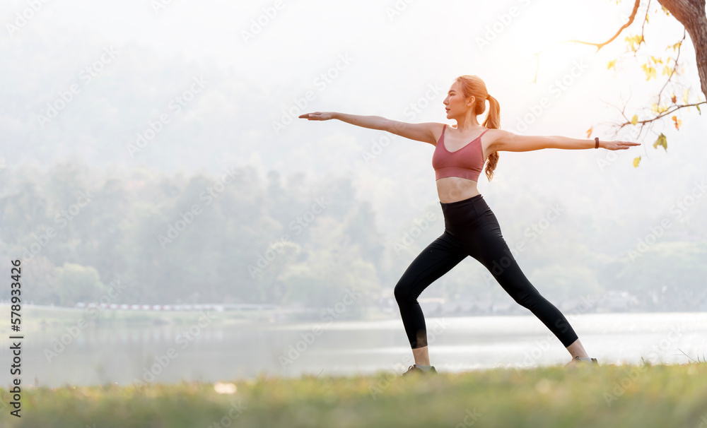Fototapeta premium Full length shot of an attractive young sportswoman warming up for a workout outdoors.