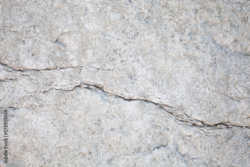 White stone surface, background, pattern with cracks