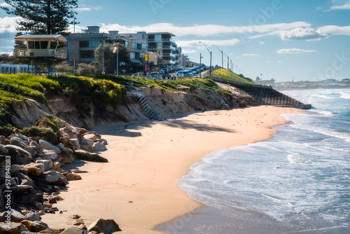 North Cronulla Beach in Sydney almost vanishes after a severe storm. The waves reached the sea wall and huge sand was ripped from the beach due to coastal erosion in June 2022, NSW, Australia.