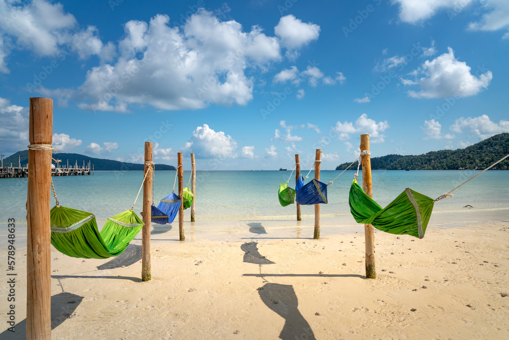 The hammocks in the sea on paradise island Villa Koh Rong Samloem. This is a small island that attracts many visitors from all over the world because of its beauty. It is located in the Gulf of Thaila The hammocks in the sea on paradise island Villa Koh Rong Samloem. This is a small island that attracts many visitors from all over the world because of its beauty. It is located in the Gulf of Thaila
