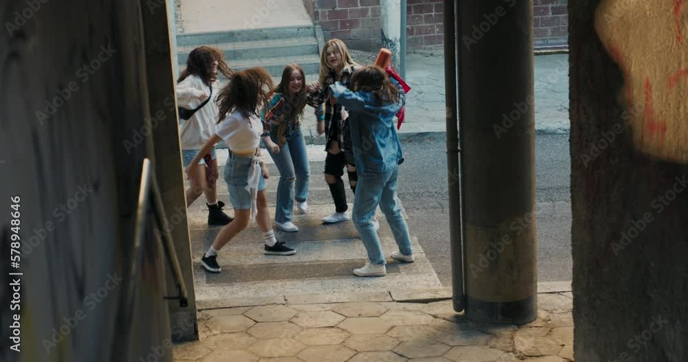 Close up shot selective focus on girls company friends dancing wearing denim fashionable stylish clothes showing skills movements actions relaxing resting. Close up shot selective focus on girls company friends dancing wearing denim fashionable stylish clothes showing skills movements actions relaxing resting.