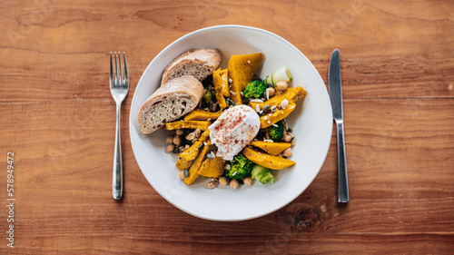 Healthy pumpkin Salad on a wooden table
