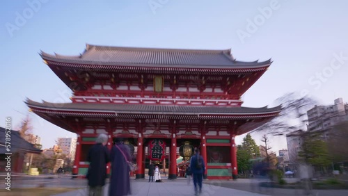 Senso-ji temple Buddhist pagoda in Asakusa, Tokyo, hyper lapse of famous Japanese shrine, gimbal shot of walking through Japanese shrine gate. High quality 4k footage