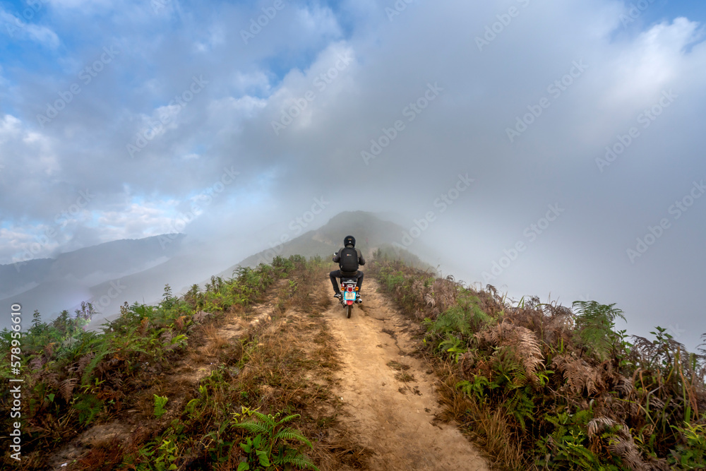 majestic scenery of Ta Xua mountain. Travelers experience on the trail of dinosaurs spine and the top of the mountains Ta Xua. This is a very popular tourist destination in Son La province, Vietnam