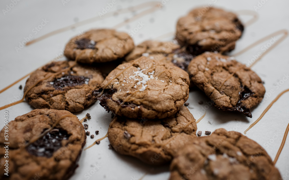 Chocolate cookies with a caramel sauce on table Chocolate cookies with a caramel sauce on table