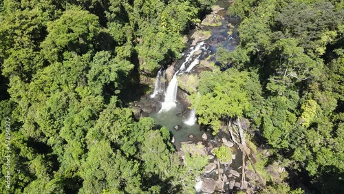 Spectacular cinematic aerial footage of Tchupala Falls near Innisfail Queensland Australia photo