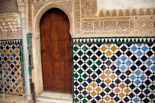Islamic art tiled wall and door in the Alhambra Palace,