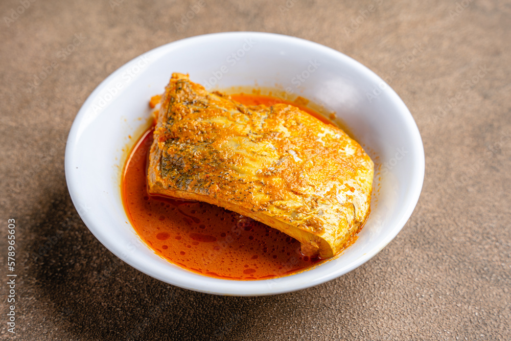 snapper curry fish (gulai ikan kakap) from padang, west sumatera, indonesia snapper curry fish (gulai ikan kakap) from padang, west sumatera, indonesia