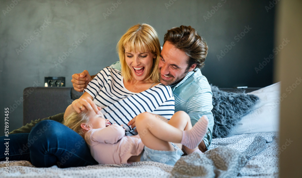 Fototapeta premium Happy family having fun time at home. People love child home concept.
