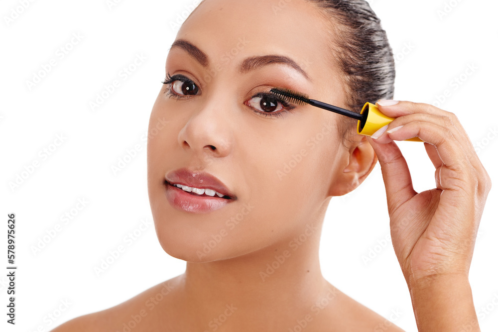 Highlighting her stunning eyes. Studio shot of a beautiful young woman applying mascara against a white background.