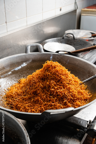 Making Proses Dried potato or potato mustofa (indonesian : Kering Kentang Potato Balado) is the term for dry match-shaped potatoes stir-fried with Indonesian spices. photo