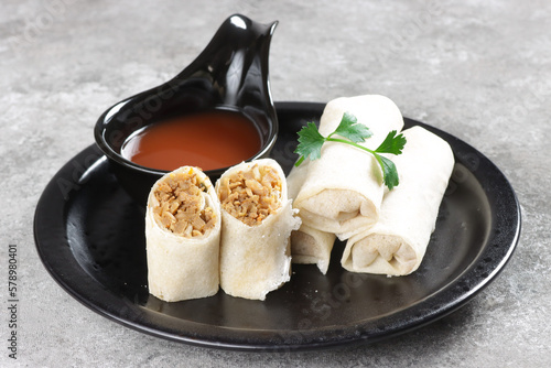 Popiah Basah or Lumpia Basah is Unfried Spring Rolls Filled with Bamboo Shoots. photo