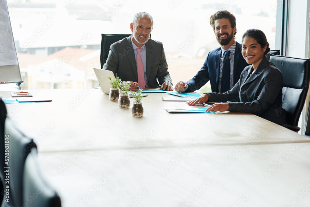 Doing business is in our blood. a group of executives having a meeting in a boardroom. Doing business is in our blood. a group of executives having a meeting in a boardroom.