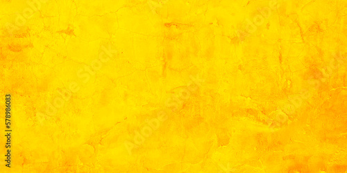 Yellow grunge wall for texture background. Cement orange background