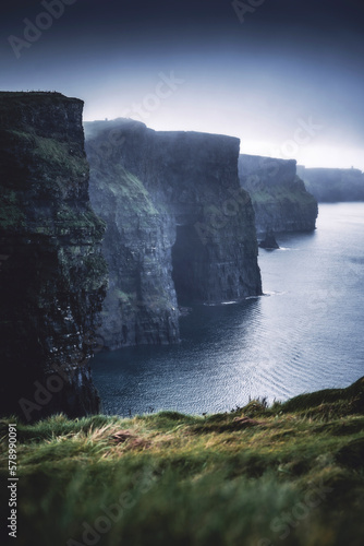 Le famose Cliffs of Moher in un atmosfera da brividi con la nebbia che quasi le ricopre, sono una delle più celebri attrazioni in Irlanda. photo
