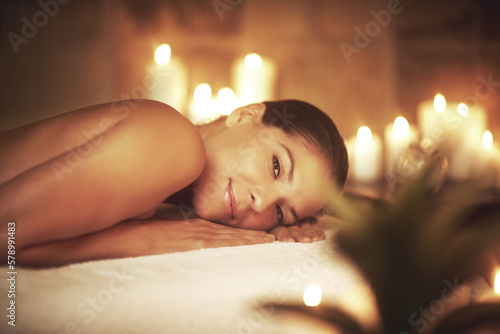 Massage day is my favorite day of the week. Closeup shot of a young woman relaxing during a spa treatment.
