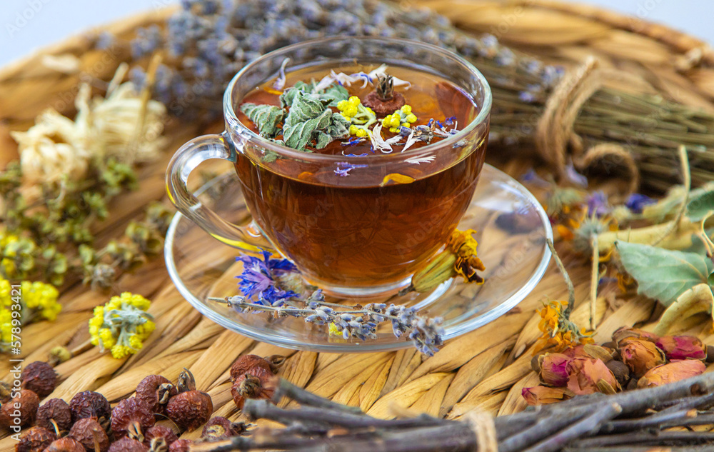 Herbal tea with medicinal herbs and flowers. Selective focus. Herbal tea with medicinal herbs and flowers. Selective focus.
