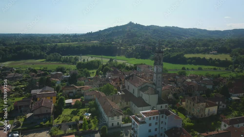 Establisher aerial view of Pagnano townscape with Church tower, circle pan Establisher aerial view of Pagnano townscape with Church tower, circle pan