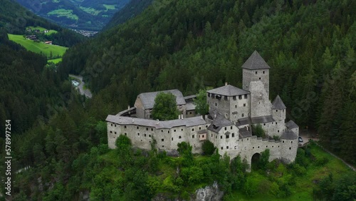 Sensational establisher aerial shot of Taufers Castle in South Tyrol, Italy photo