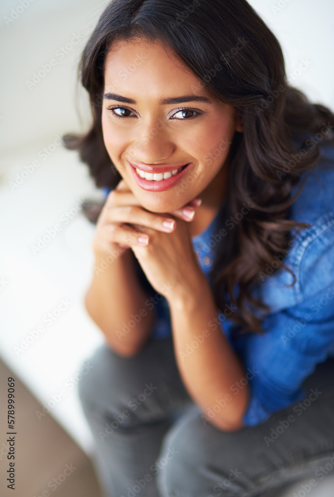 The weekends are a great time to kick back and relax. a young woman relaxing at home on the weekend. The weekends are a great time to kick back and relax. a young woman relaxing at home on the weekend.