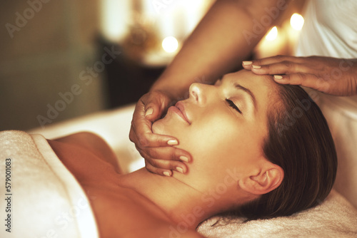You are one massage away from a good mood. Closeup shot of a young woman enjoying a head massage at the spa.