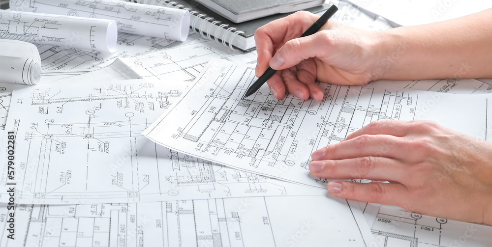 Architects concept, engineer architect designer freelance work on start-up project drawing, construction plan architect design working drawing sketch plans blueprints and making construction model Architects concept, engineer architect designer freelance work on start-up project drawing, construction plan architect design working drawing sketch plans blueprints and making construction model