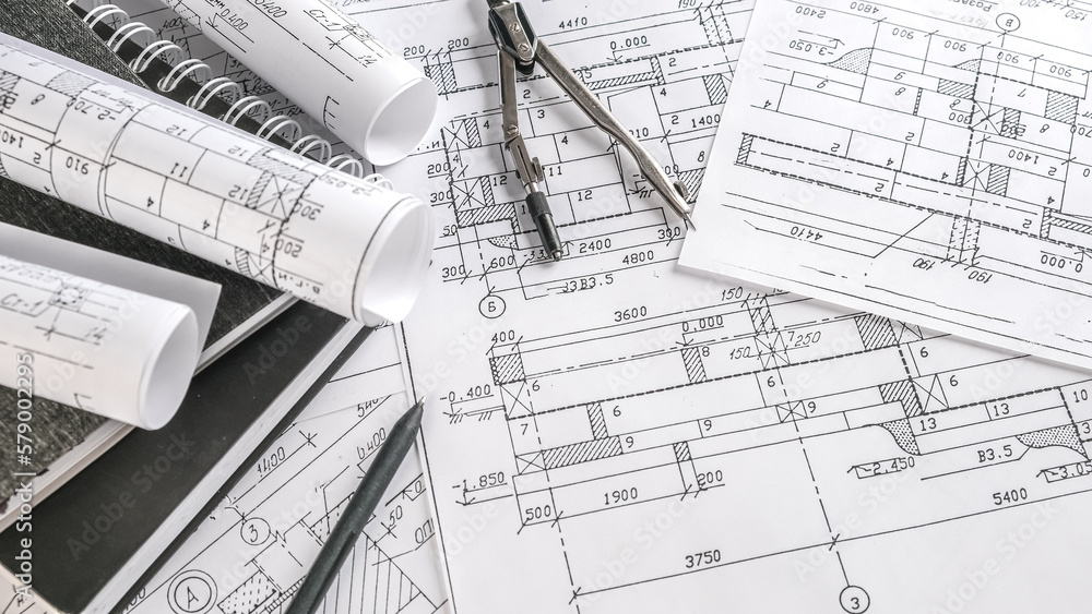 Architects concept, engineer architect designer freelance work on start-up project drawing, construction plan architect design working drawing sketch plans blueprints and making construction model Architects concept, engineer architect designer freelance work on start-up project drawing, construction plan architect design working drawing sketch plans blueprints and making construction model
