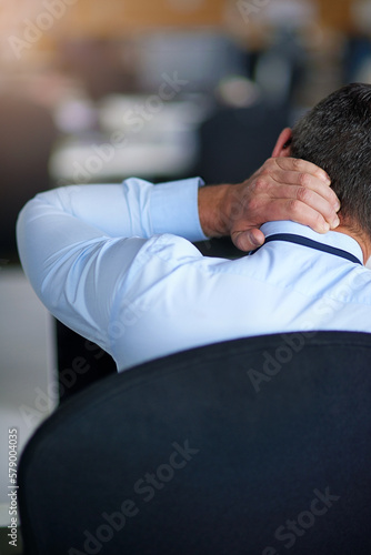 He needs some stress management. a businessman suffering from neck pain.